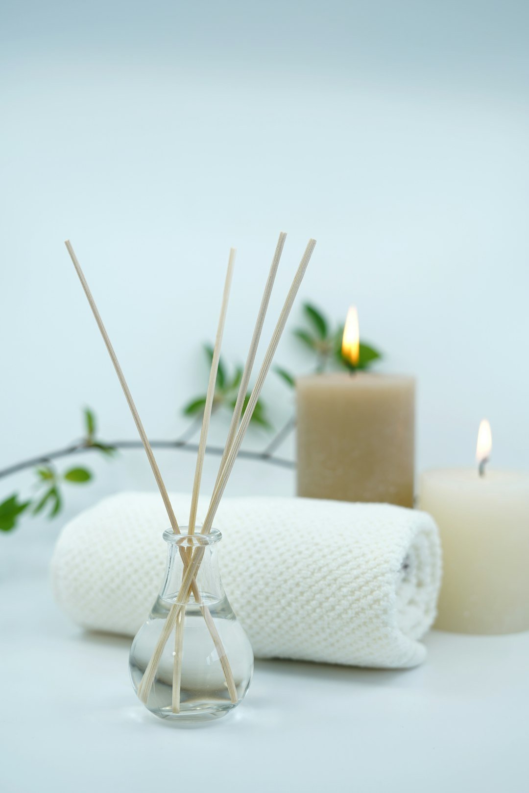 Home Beautiful image with spa and relaxing concept with scented oil fragrance diffuser and candles and towels