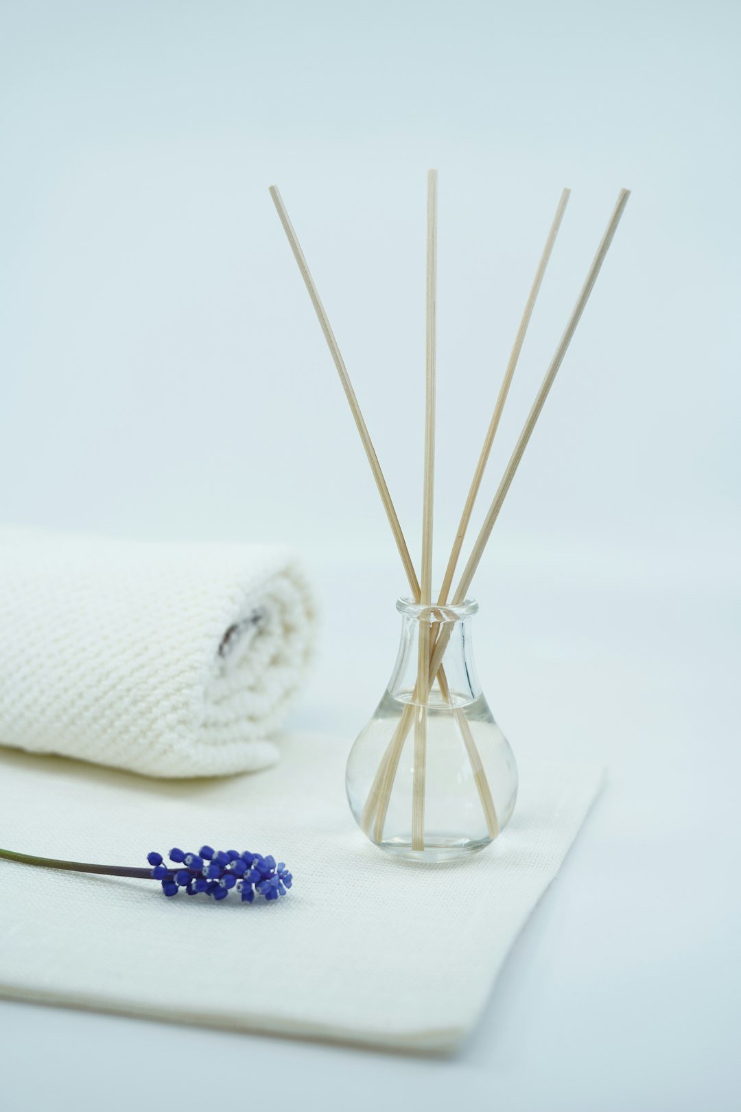 About Beautiful image with spa and relaxing concept with scented oil fragrance diffuser and candles and flower